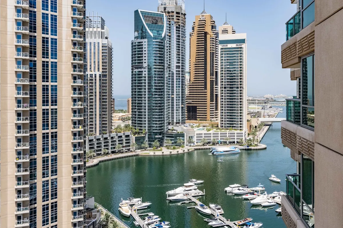 Residential towers beside the yacht-lined water of Dubai Marina